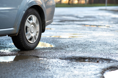 car pothole road hazard